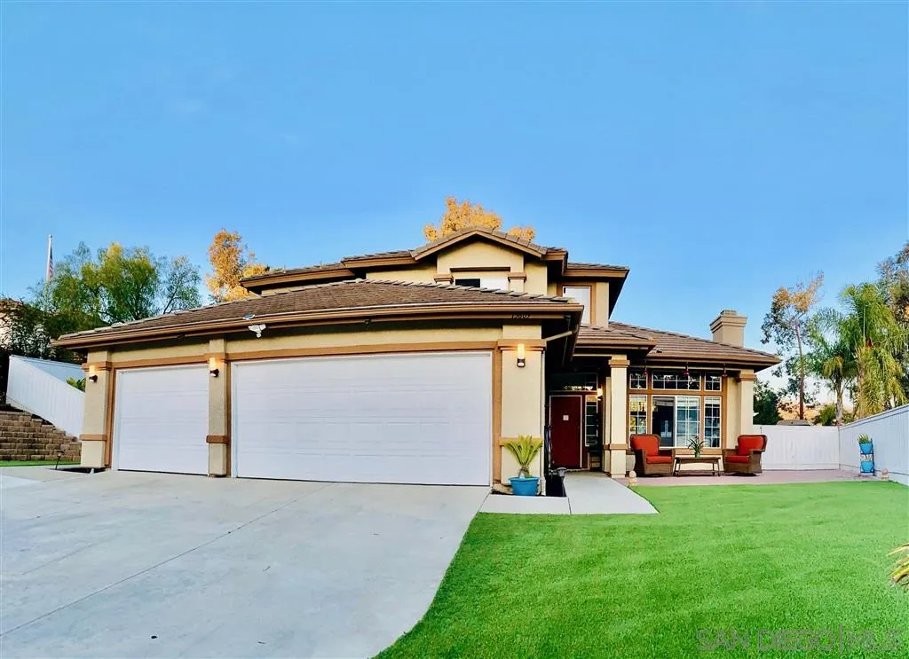 13609 Sunset View Road Poway, CA 92064 - Photo 1 of 15 a front view of a house with a yard and garage