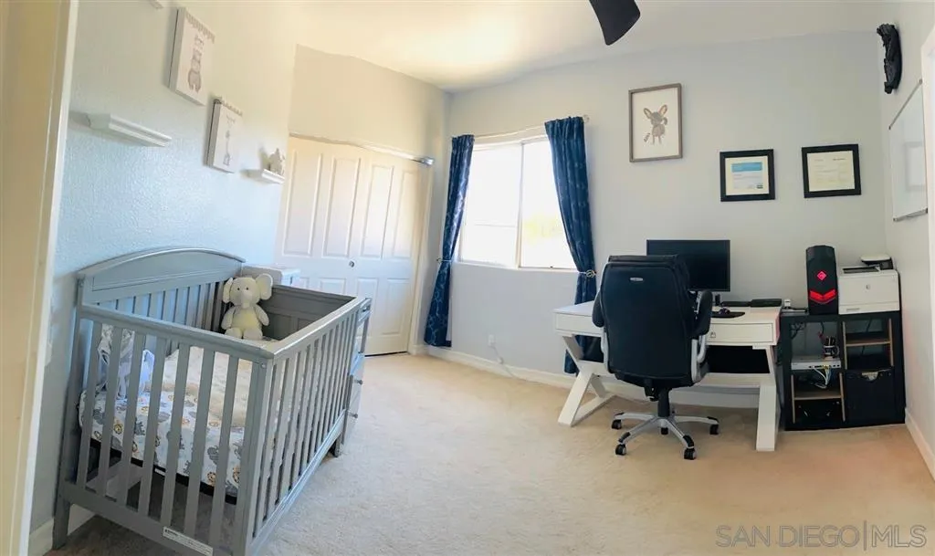 13609 Sunset View Road Poway, CA 92064 - Photo 11 of 15 a bedroom with furniture and a window