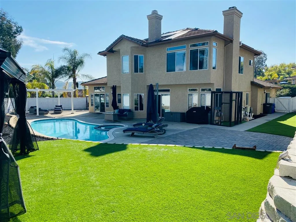 13609 Sunset View Road Poway, CA 92064 - Photo 13 of 15 a front view of a house with swimming pool having outdoor seating