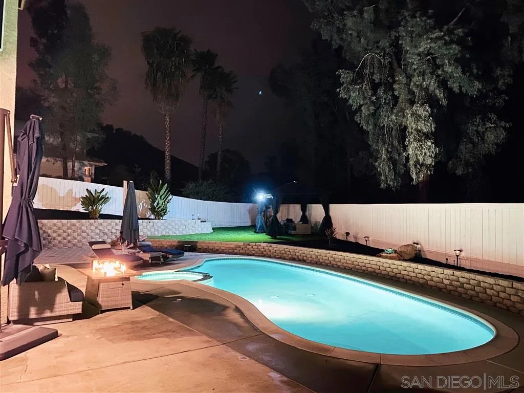 13609 Sunset View Road Poway, CA 92064 - Photo 14 of 15 a view of a swimming pool with an outdoor space and seating area