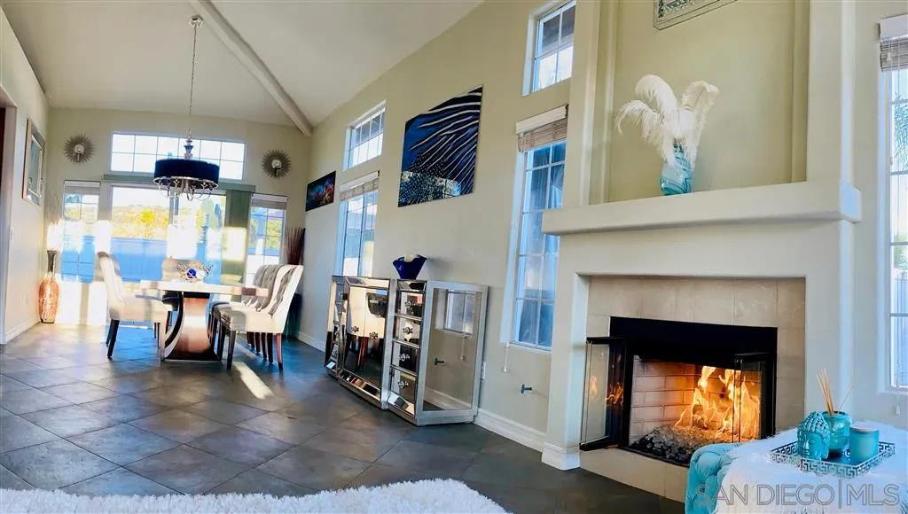 13609 Sunset View Road Poway, CA 92064 - Photo 4 of 15 a living room with lots of furniture and a fireplace