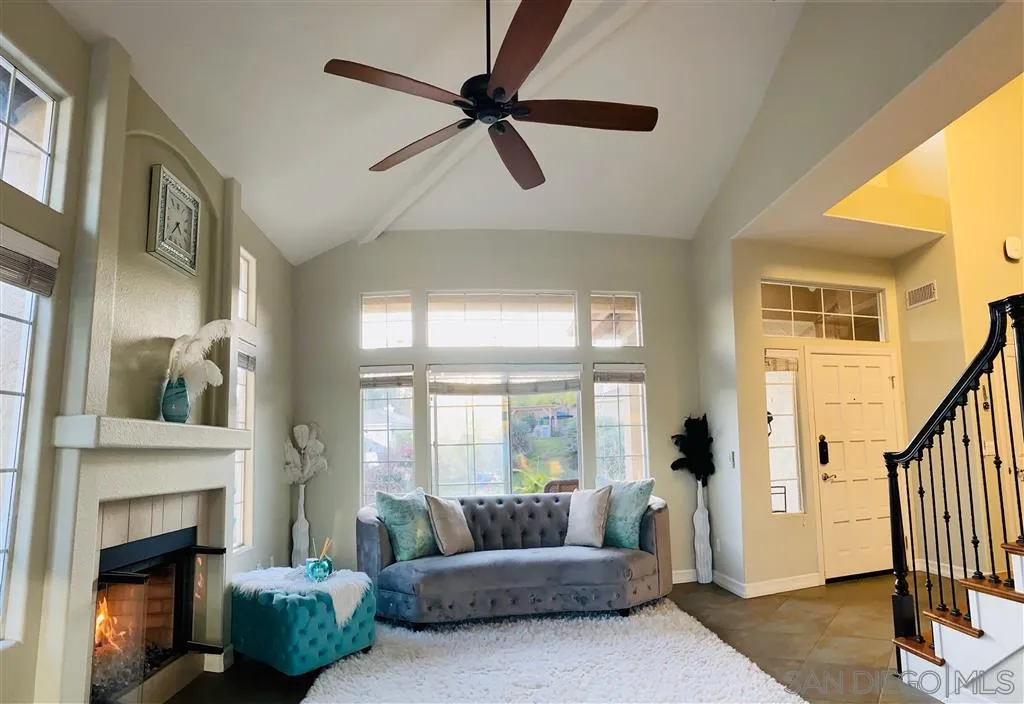 13609 Sunset View Road Poway, CA 92064 - Photo 5 of 15 a living room with furniture and a fireplace