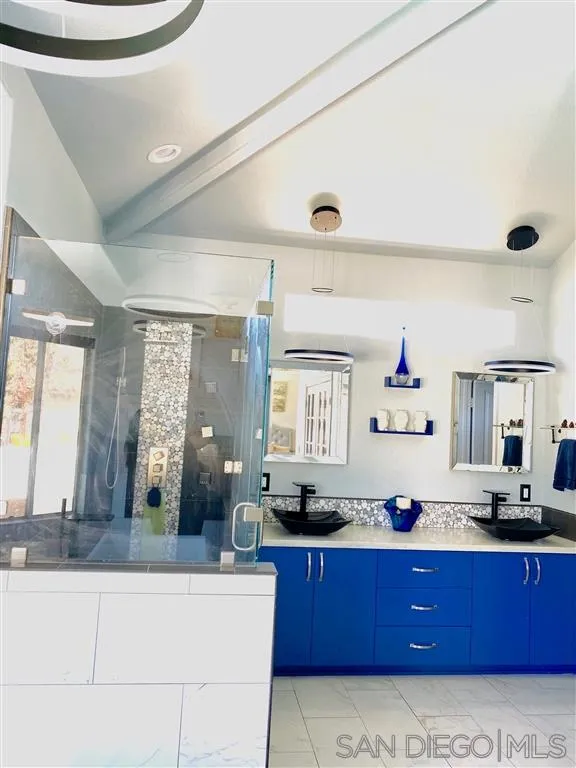 13609 Sunset View Road Poway, CA 92064 - Photo 7 of 15 a bathroom with a tub sink and mirror