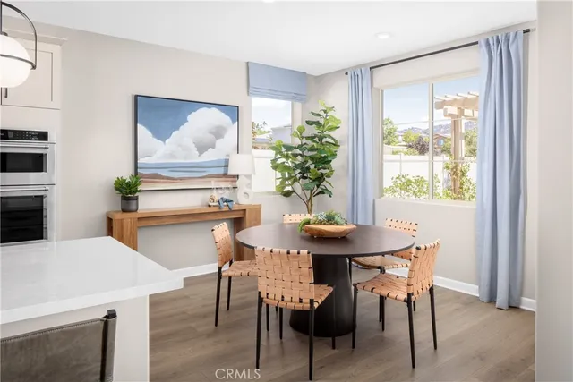 a view of a dining room with furniture and window