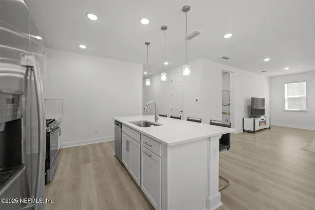 a living room with furniture window and a flat screen tv