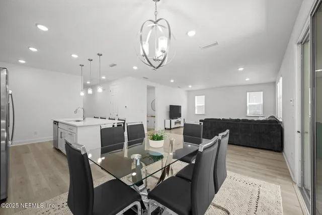a bathroom with a double vanity sink toilet and a mirror