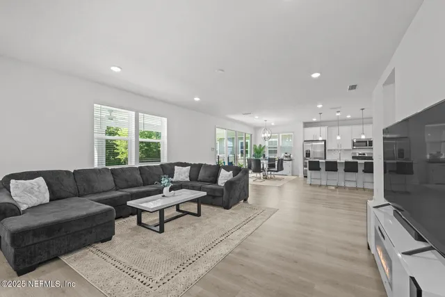 a view of a house with a backyard and porch