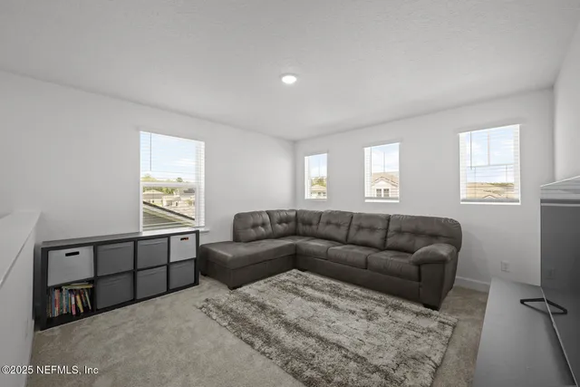 a front view of a house with a yard table and chairs