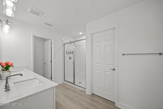 a aerial view of a house with a big yard plants and large trees