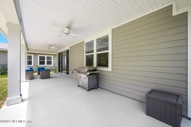 an aerial view of a house with a lake view