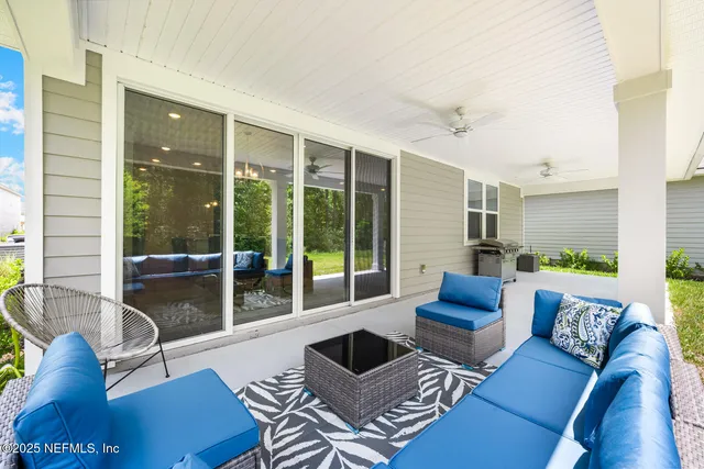 an aerial view of a house with a garden and lake view