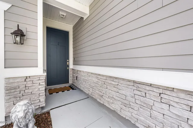 a kitchen with stainless steel appliances a refrigerator sink and microwave