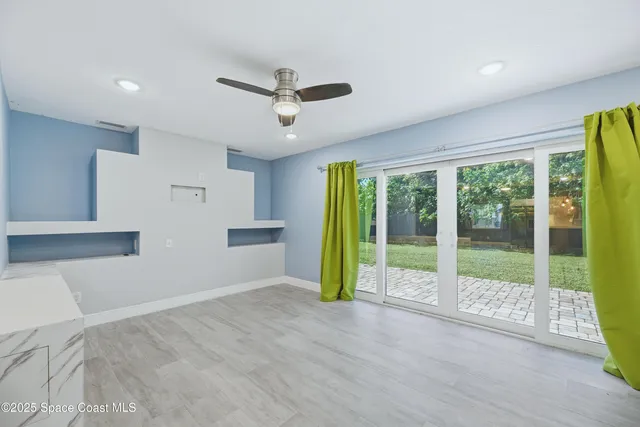 a view of livingroom with furniture and floor to ceiling window