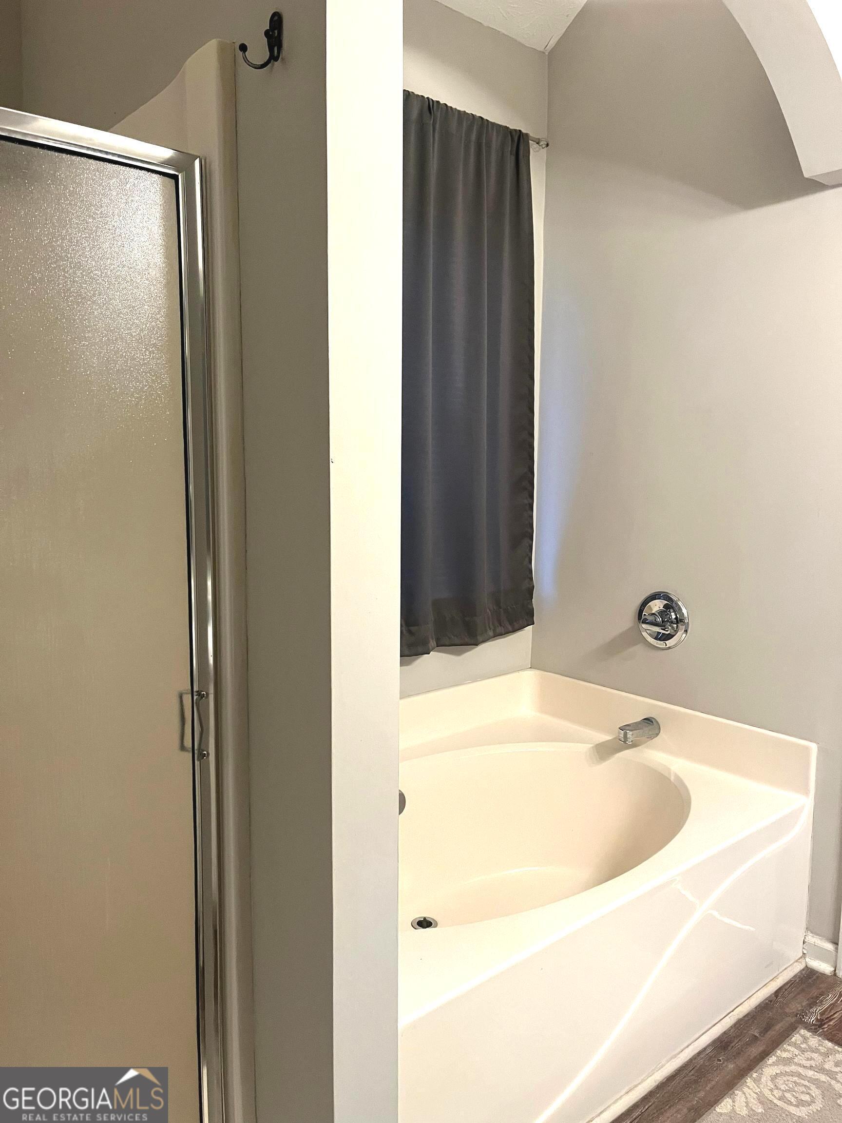 803 Lazy Lane Winder, GA 30680 - Photo 12 of 16 a bathroom with a sink and a tub