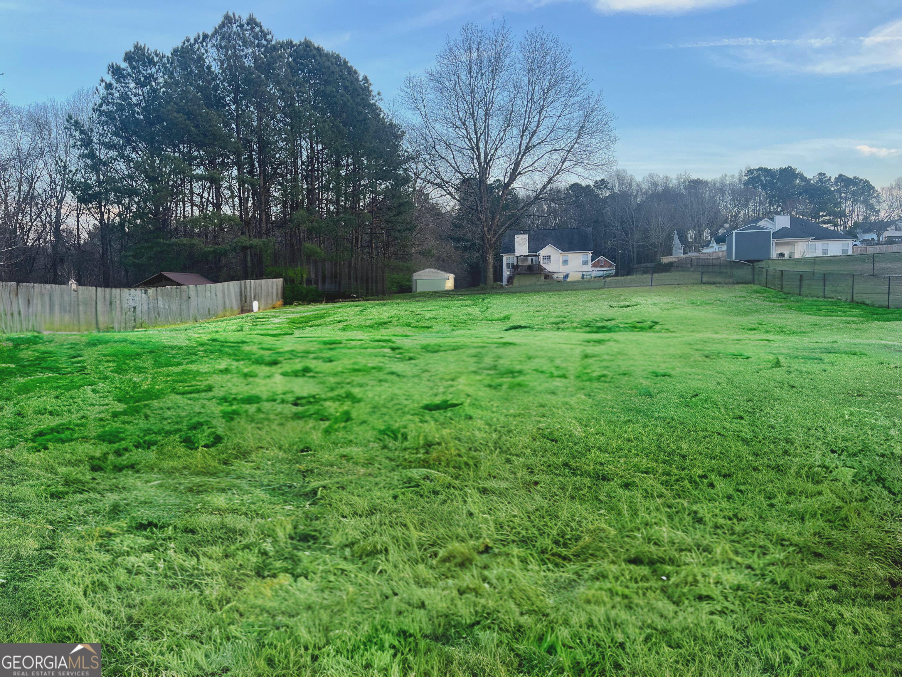 803 Lazy Lane Winder, GA 30680 - Photo 16 of 16 a backyard of a house with lots of green space