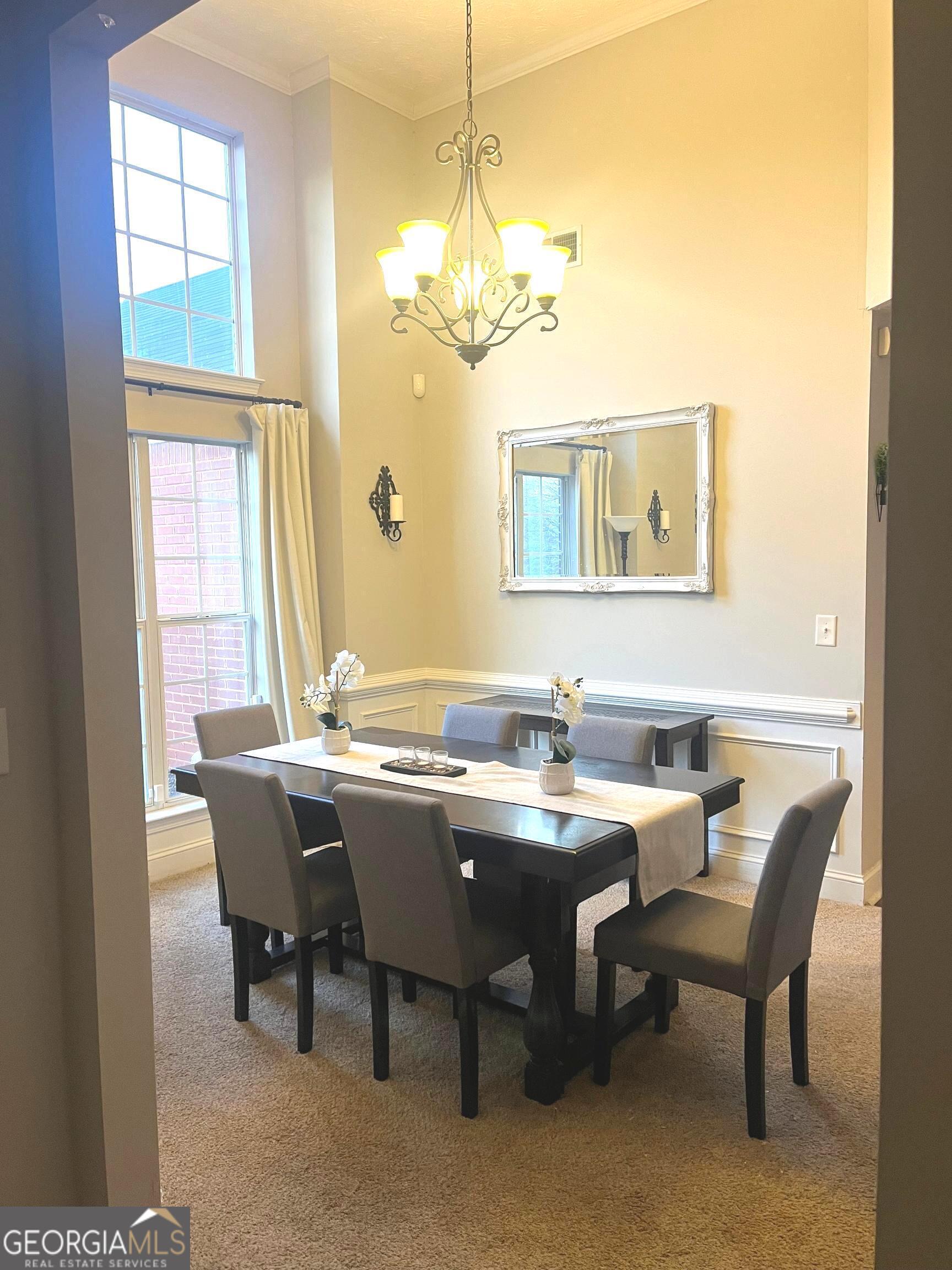 803 Lazy Lane Winder, GA 30680 - Photo 5 of 16 a view of a dining room with furniture and window