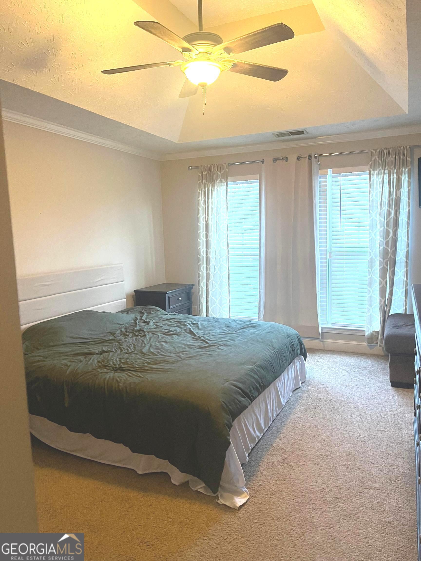 803 Lazy Lane Winder, GA 30680 - Photo 10 of 16 a bedroom with a bed and window