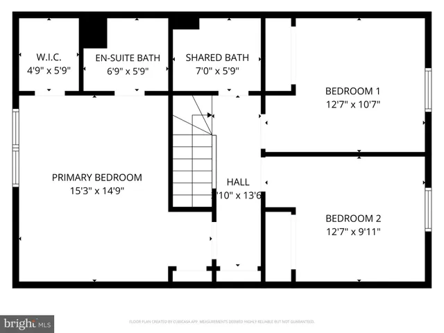 a bedroom with bed and a potted plant