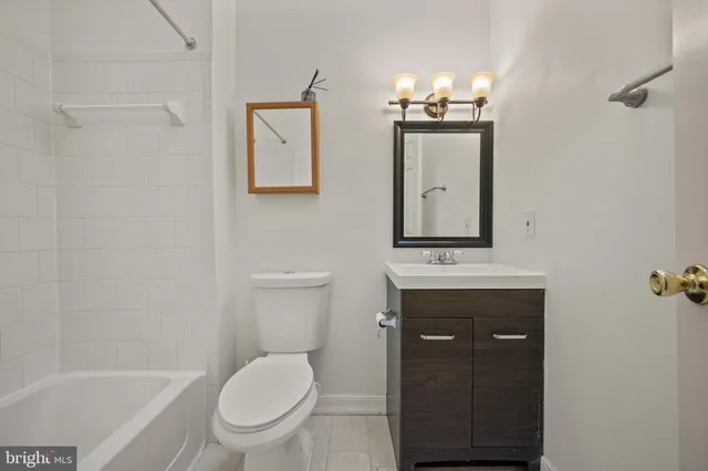 a bedroom with a bed and a table