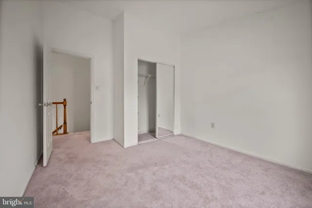 a view of a workspace with furniture and a potted plant