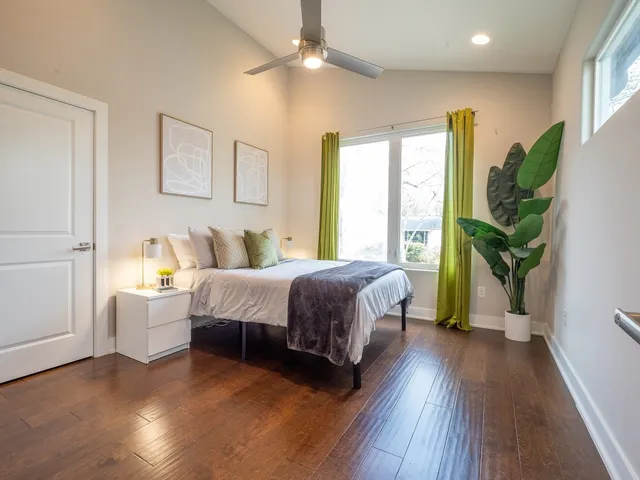 a spacious bathroom with a granite countertop sink and a mirror