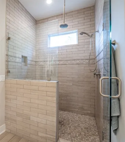 a spacious bathroom with a double vanity sink and a mirror