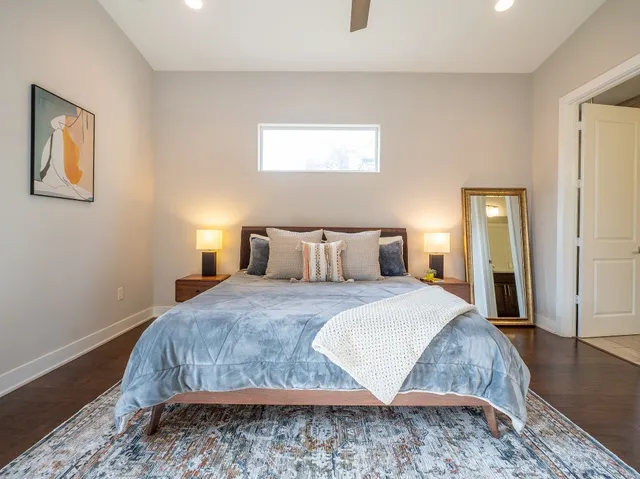 a bedroom with a bed and a couch