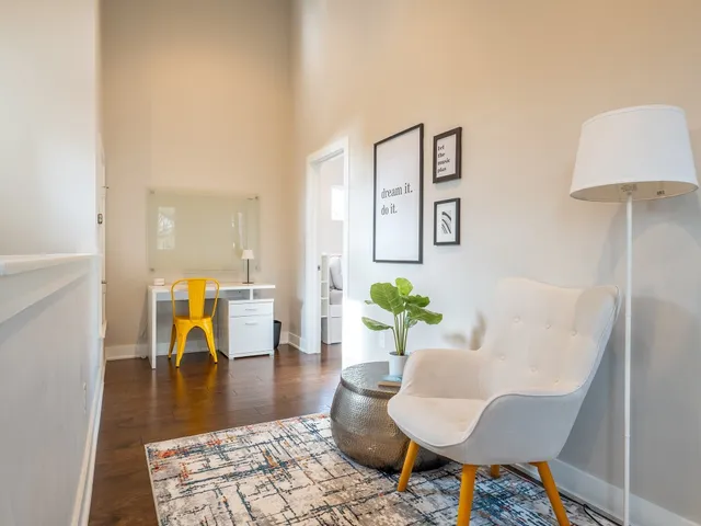 a bathroom with a double vanity sink a toilet and a bathtub