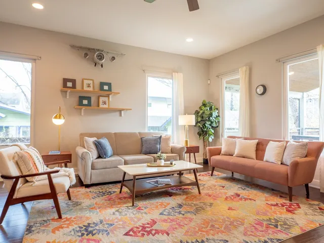 a living room with furniture and a large window