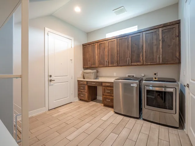 a house that has a tree in front of the house