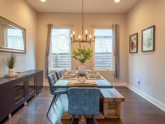 a dining room with furniture and window