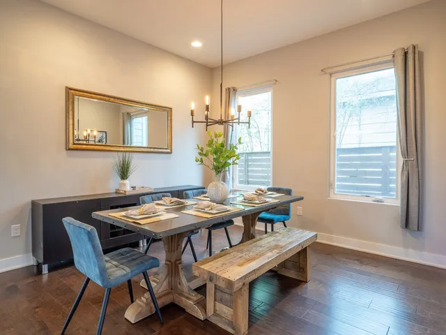 a view of a dining room with furniture and window