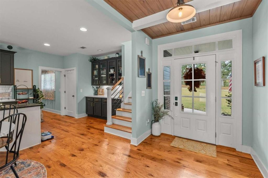 1233 Whooping Creek Road Carrollton, GA 30116 - Photo 11 of 61 a view of a livingroom with furniture and a kitchen