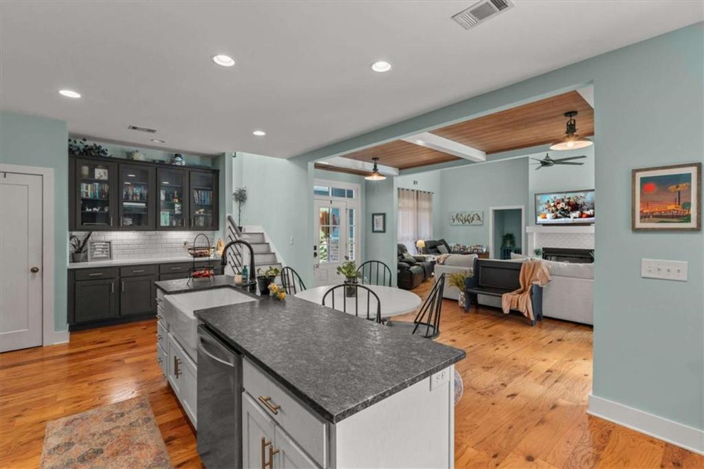 1233 Whooping Creek Road Carrollton, GA 30116 - Photo 17 of 61 a kitchen with counter space dining table and chairs