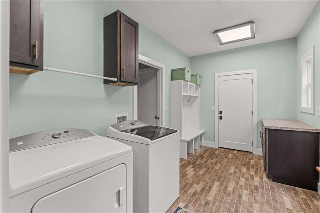 1233 Whooping Creek Road Carrollton, GA 30116 - Photo 21 of 61 a view of storage and utility room with closet dryer