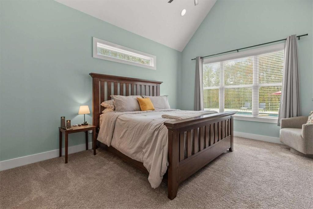 1233 Whooping Creek Road Carrollton, GA 30116 - Photo 24 of 61 a bedroom with a bed and a large window