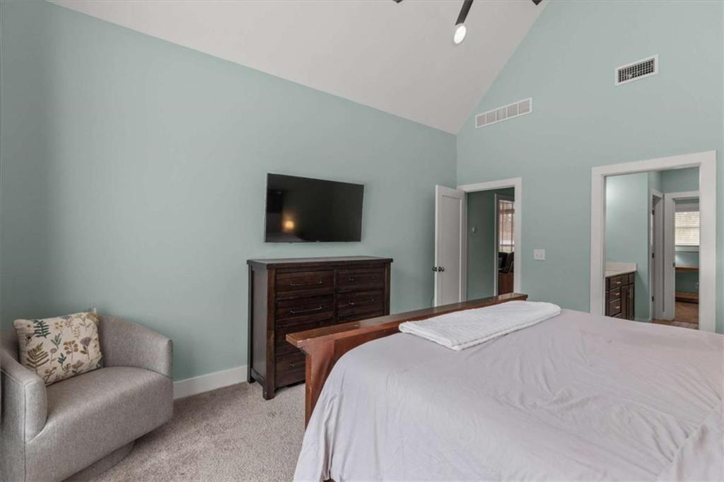 1233 Whooping Creek Road Carrollton, GA 30116 - Photo 26 of 61 a bedroom with a bed and a television