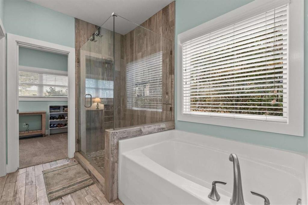 1233 Whooping Creek Road Carrollton, GA 30116 - Photo 27 of 61 a bath tub sitting in a bathroom next to a window