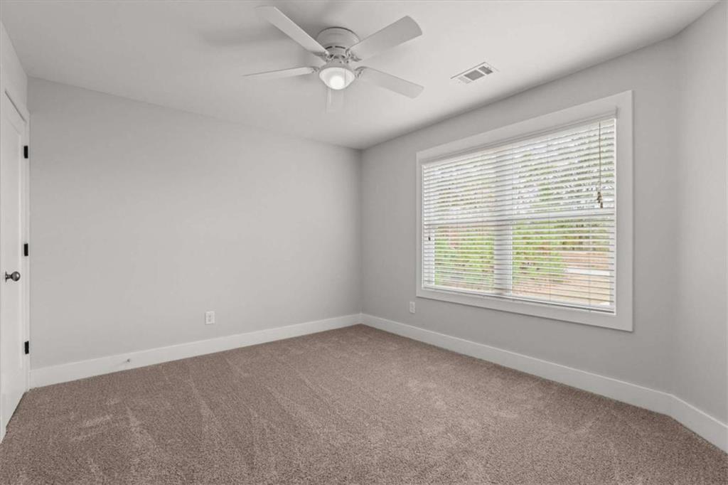 1233 Whooping Creek Road Carrollton, GA 30116 - Photo 34 of 61 a view of an empty room with a window