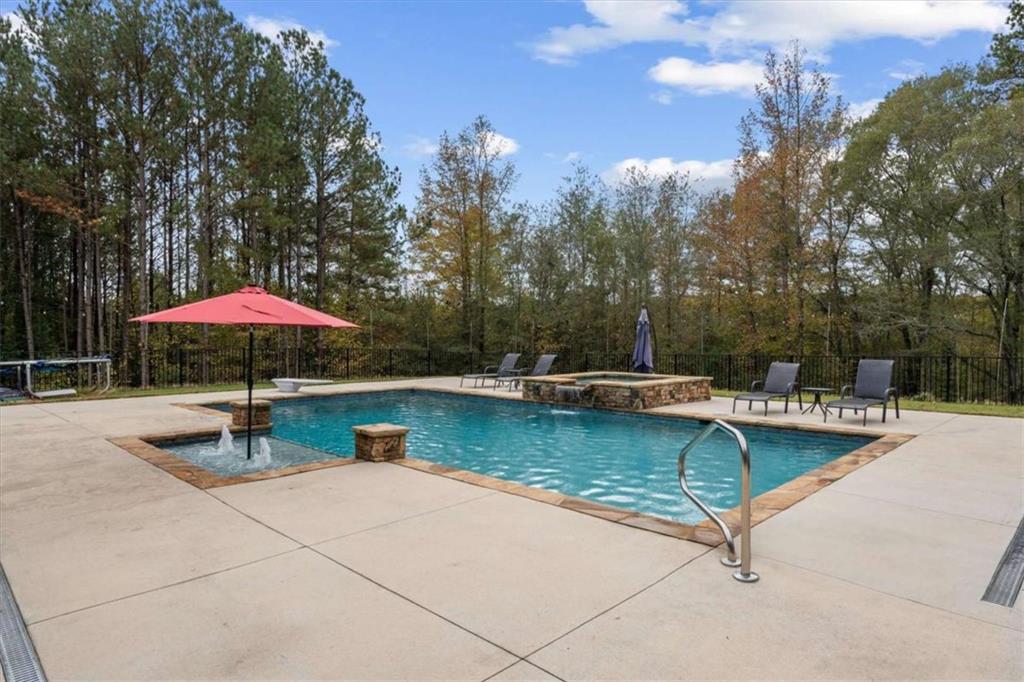 1233 Whooping Creek Road Carrollton, GA 30116 - Photo 45 of 61 a view of a swimming pool with lounge chair