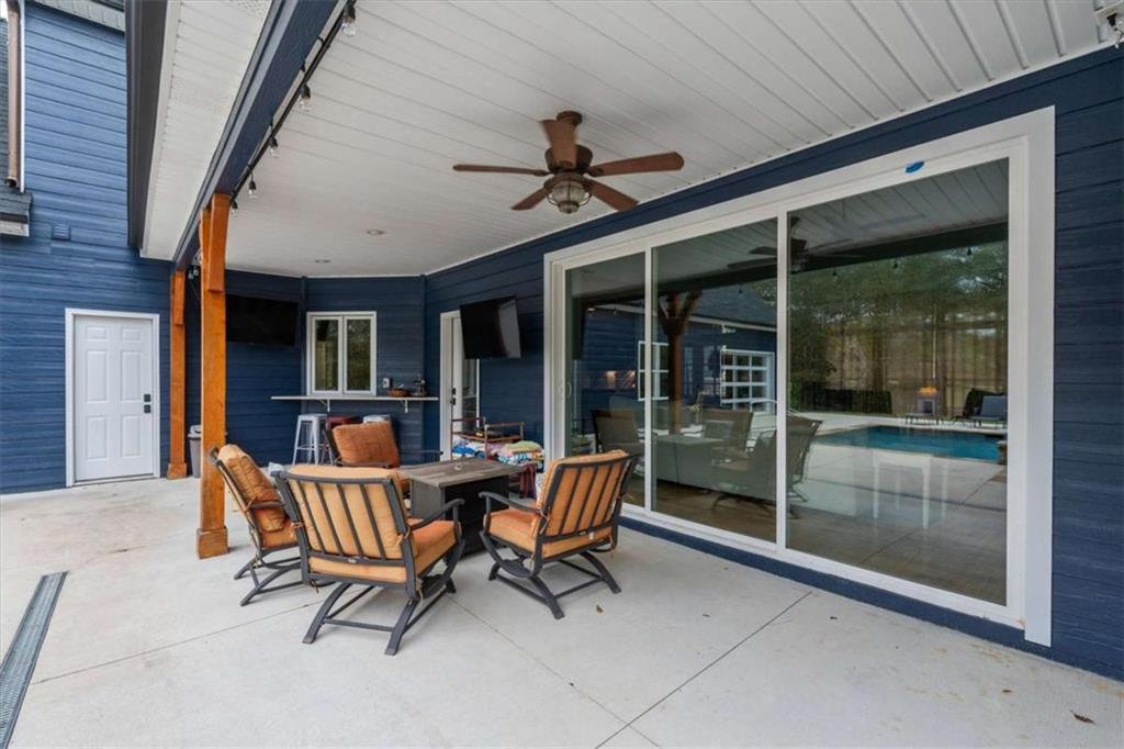 1233 Whooping Creek Road Carrollton, GA 30116 - Photo 49 of 61 a outdoor space with lounge chair glass door and glass door