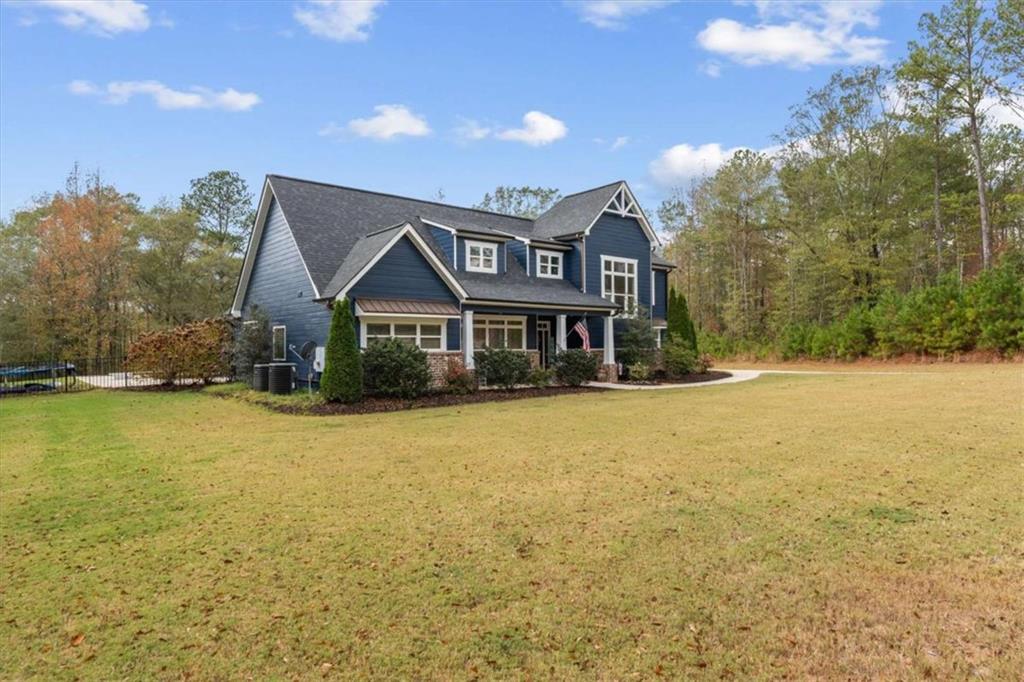 1233 Whooping Creek Road Carrollton, GA 30116 - Photo 8 of 61 a front view of a house with a yard