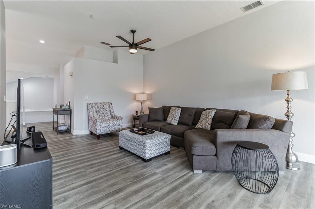 6895 Rain Lily Road, Unit 203 Naples, FL 34109 - Photo 11 of 22 a living room with furniture