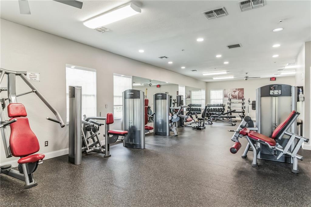 6895 Rain Lily Road, Unit 203 Naples, FL 34109 - Photo 21 of 22 a view of a room with gym equipment
