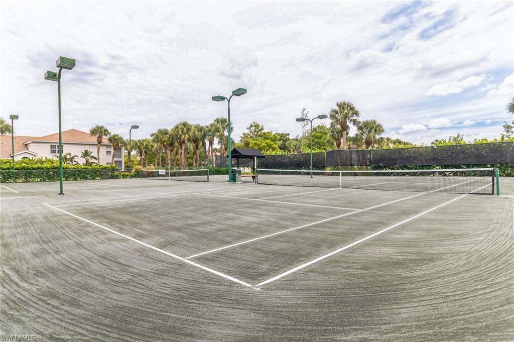 6895 Rain Lily Road, Unit 203 Naples, FL 34109 - Photo 22 of 22 a view of a tennis court