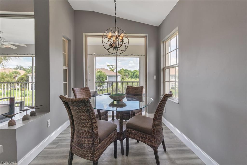 6895 Rain Lily Road, Unit 203 Naples, FL 34109 - Photo 8 of 22 a view of a dining room with furniture window and outside view