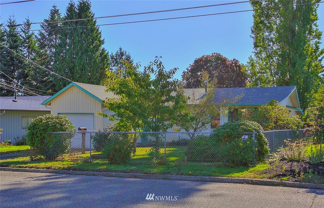 3601 Northeast 10th Street Renton, WA 98056 - Photo 1 of 25 a view of a yard in front of a house