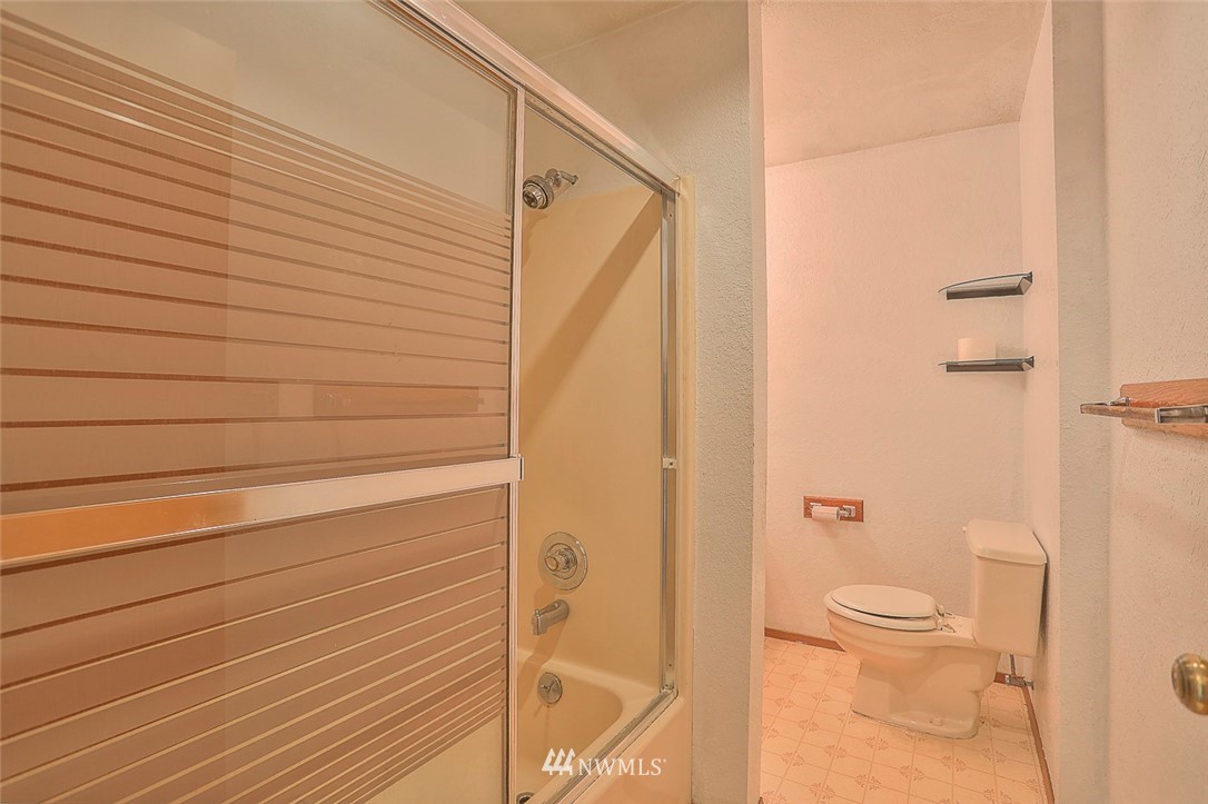 3601 Northeast 10th Street Renton, WA 98056 - Photo 15 of 25 a bathroom with a shower and a toilet