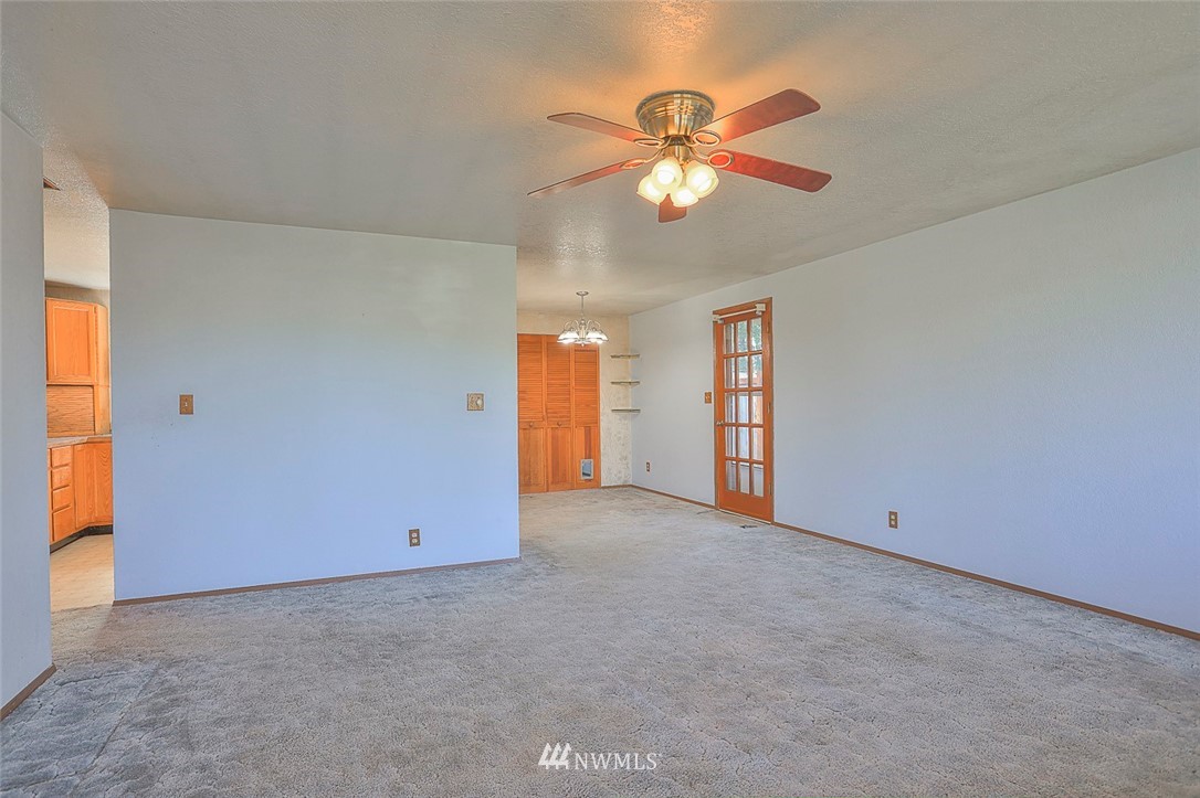 3601 Northeast 10th Street Renton, WA 98056 - Photo 4 of 25 an empty room with closet and a chandelier fan