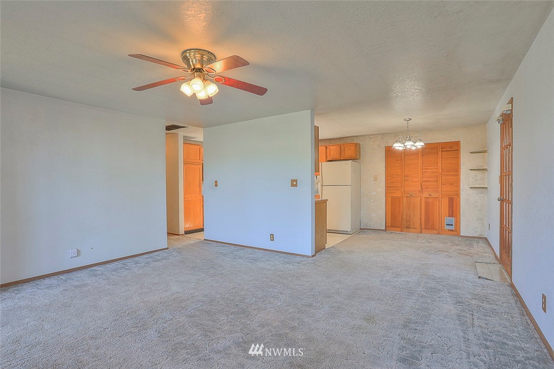 3601 Northeast 10th Street Renton, WA 98056 - Photo 5 of 25 an empty room with closet and a chandelier fan